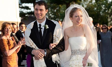 Chelsea Clinton walks with Marc Mezvinsky after their wedding ceremony at Astor Court in Rhinebeck