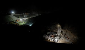 Chilean Trapped Miners: Chilean workers start a drilling machine