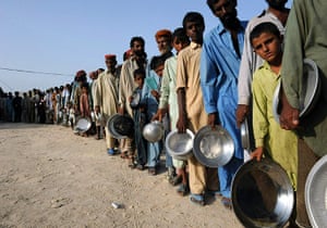 Pakistan Flood Update: Pakistani flood-affected survivors queue for food