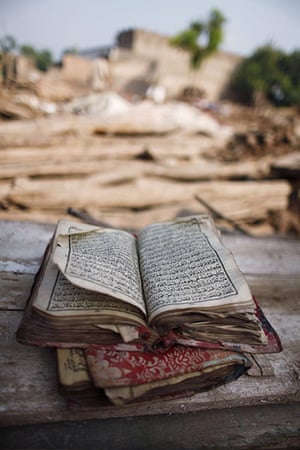 Pakistan Flood Update: A Koran sits on a bench after it was recovered froma home in Pakistan