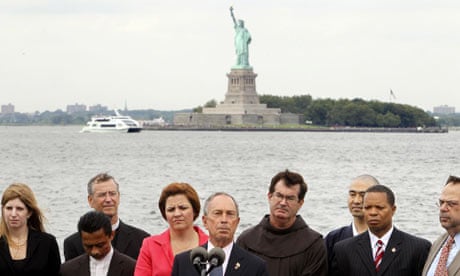 Michael Bloomberg speaking before the Statue of Liberty