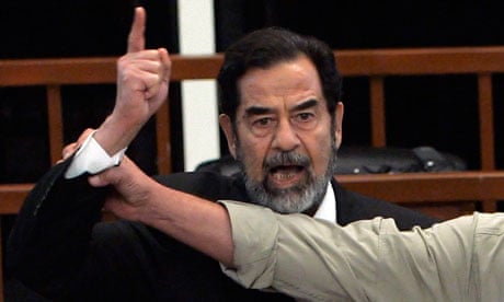 Saddam Hussein shouts in defiance as the death penalty is handed down against him