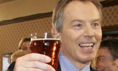 Tony Blair enjoys a pint.