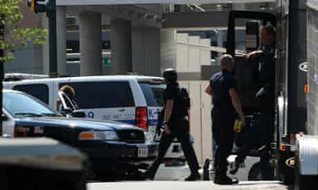 Police take up position in front of the Discovery Channel headquarters in Silver Spring