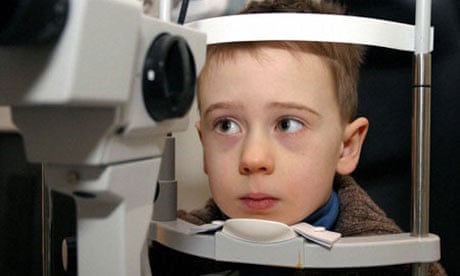 Young child having his eyes tested at opticians. Image shot 2009. Exact date unknown.