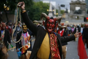 mexican celebrations: Devil dancers perform during the bicentennial parade in Mexico City