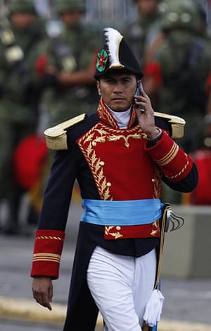 Mexico day 3: A Mexican army soldier dressed in a historical uniform uses a mobile phone 
