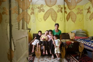 Roma in Romania: An elderly Roma woman poses for a portrait with her grandchildren