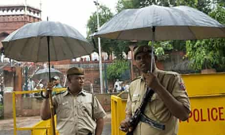 Indian policemen stand guard near the Jama Masjid mosque
