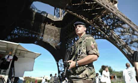 French soldier patrols at the Eiffel tower in Paris