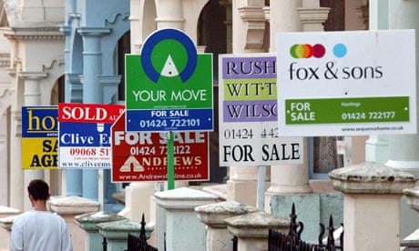 Estate agents' signs on a street
