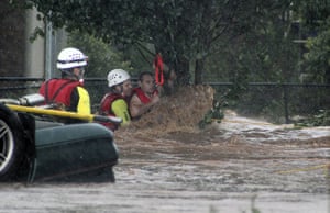 Floods in Australia: A man is rescued by emergency workers after he was stranded 