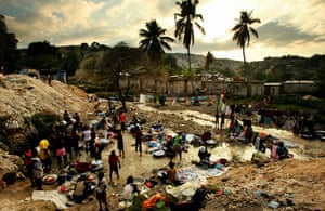Haiti then and now: January 2011: Haitians bathe and wash clothes in the same stream