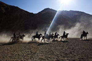 24 hours in pictures: Afghan horsemen play Buzkashi 