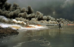 Gulf War: A firefighter tries to extinguish an oil well fire at Greater Burhan