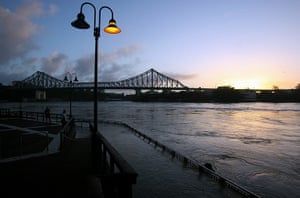 Brisbane floods: Pathways are flooded as the river bursts its banks