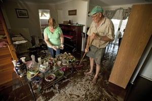 Brisbane floods: Helen and Trevor Goschnick mop up the aftermath of a metre of floodwaters