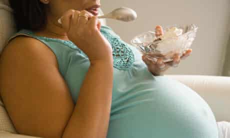Pregnant woman eating ice cream