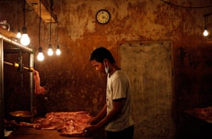 24 hours in pictures: An Indonesian vendor prepares meat to sell at a market in Jakarta