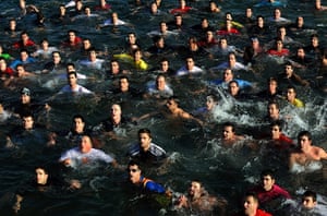 Orthodox epiphany: Hundreds of Christian Orthodox believers swim for a wooden cross