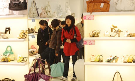 Chinese women shop for shoes at a mall i