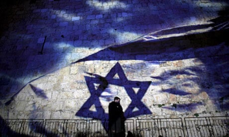 An Israeli flag is projected on to the Old City walls of Jerusalem