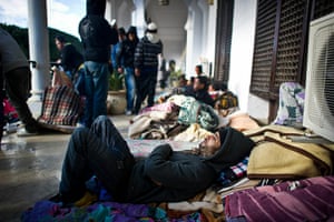 Tunisia Protests: A protester sleeps outside Prime Minister's office in Tunis