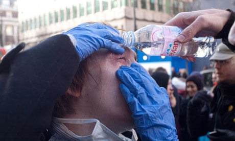Protester washing eyes