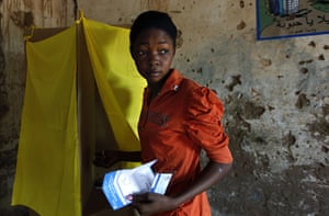 Sudan referendum: A Southern Sudanese woman votes in a polling station in Haj Yousef