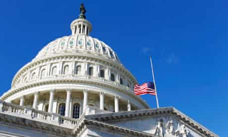 US Capitol building with flag at half-mast