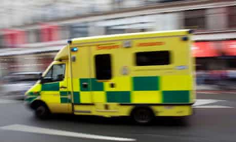 An ambulance passes at high speed in central London.