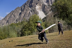 Kalash valley, Pakistan: Kalash boys playing in a field at the mountain homeland