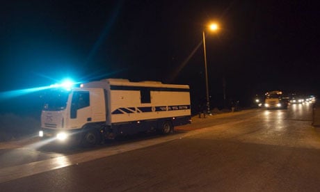 A convoy carrying Palestinian prisoners being exchanged for Gilad Shalit leaves the Ketziot prison