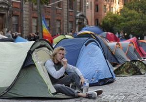 Occupy London: A man brushes his teeth as he camps near St Paul's Cathedral