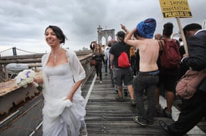 Occupy Wall Street: A bride walks past demonstrators, Brooklyn Bridge