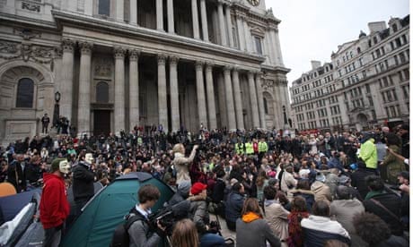 Occupy protesters gather for a meeting in front of St Paul's Cathedral in London