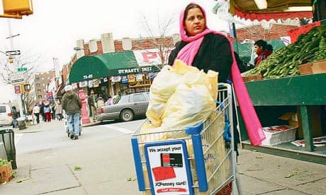 Indian woman with a supermarket trolley in a New York street