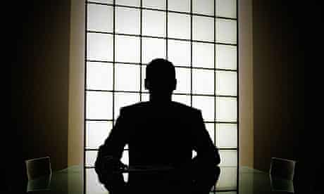 Silhouette of man in boardroom