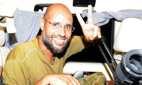 Saif al-Islam gestures as he talks to reporters in Tripoli on 23 August, 2011.