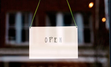 'Open' sign on small business door