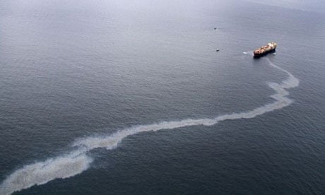 An oil slick streams from the Rena, a 47,000 tonne ship grounded in New Zealand's Bay of Plenty