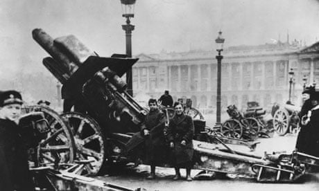 Soldiers sitting on a captured Big Bertha siege gun