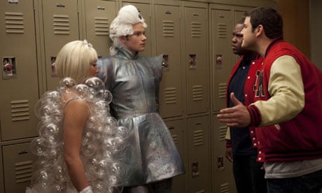 Out and proud Kurt (centre) is confonted by in-the-closet jock bully Karofsky (right) in Glee.