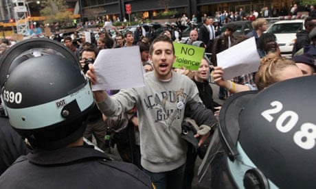 Protesters brandish copies of a court order outside Zuccotti Park