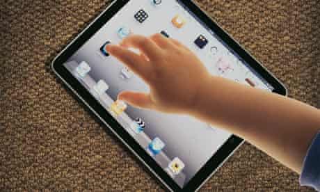 Techno-toddlers: child's arm and iPad