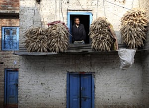 FTA: Navesh Chitrakar: A man looks out from a window of his hilltop home in Lalitpur