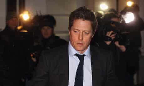 Hugh Grant leaves court after giving evidence to the Leveson inquiry