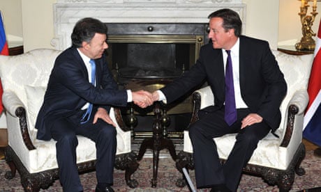 Colombia's president Juan Manuel Santos greets David Cameron