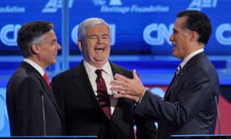 Jon Huntsman confers with Newt Gingrich and Mitt Romney