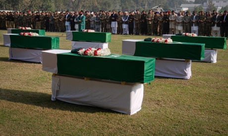 Pakistani flags cover the coffins of soldiers killed in the Nato border attack on Saturday